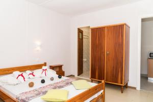 A bed or beds in a room at Roussa's Apartments