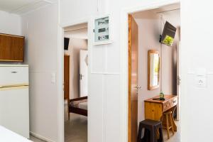 A kitchen or kitchenette at Roussa's Apartments