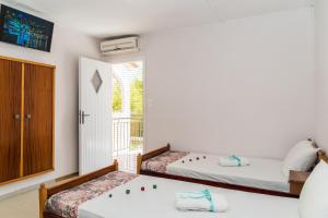 A bed or beds in a room at Roussa's Apartments