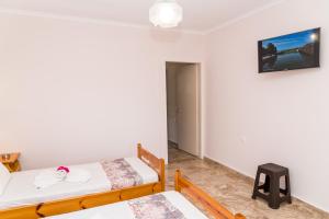 A bed or beds in a room at Roussa's Apartments