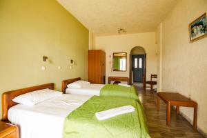 Кровать или кровати в номере Hotel Philoxenia