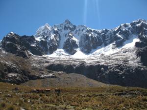 a group of people standing in front of a mountain at SANTA CRUZ TREKKING 4 DAYS from Vaqueria to Cashpampa purchase one night valued for 4 days trekking in Huaraz +46 photos