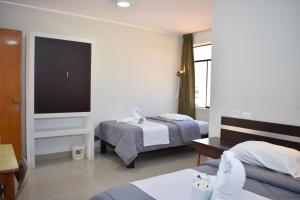 Katil atau katil-katil dalam bilik di Real Inka Hotel