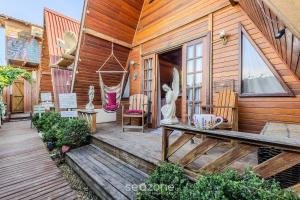 Zahrada ubytování Studios completos perto da praia da Armação e do Parque Beto Carrero - TRS