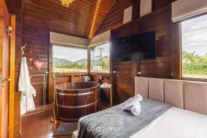 TV a/nebo společenská místnost v ubytování Studios completos perto da praia da Armação e do Parque Beto Carrero - TRS