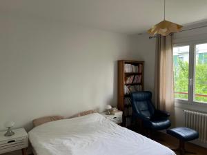 Posteľ alebo postele v izbe v ubytovaní Maison avec jardin, au centre de Nancy, à 2 pas de la Fac de lettres