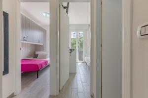 A bed or beds in a room at Lido degli Estensi Seaview Apartment