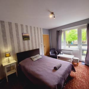 Ένα ή περισσότερα κρεβάτια σε δωμάτιο στο Willa Arte