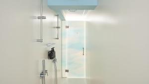 a shower with a glass door in a bathroom at Hotel Indigo Albufeira by IHG in Albufeira