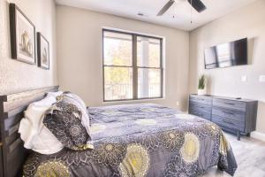 a bedroom with a bed and a window and a dresser at Vacation Together at Our 2 Condos Providing 6 Bedroom Suites in Osage Beach +23 photos