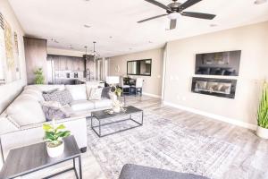 a living room with a couch and a table at Vacation Together at Our 2 Condos Providing 6 Bedroom Suites in Osage Beach