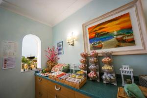 a store with vases on display in a room at Hotel Rivamare in Ischia