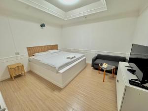 Ένα ή περισσότερα κρεβάτια σε δωμάτιο στο Pophouse