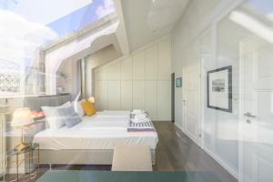 A bed or beds in a room at Executive Suite Schottenring