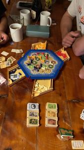 a wooden table with a boardgame at Periko´s Youth Hostel in San Carlos de Bariloche