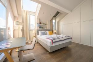 A bed or beds in a room at Executive Suite Schottenring