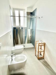 a bathroom with a toilet and a shower at Dimora degli Affreschi in Riposto +24 photos