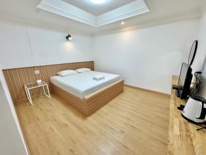 Ένα ή περισσότερα κρεβάτια σε δωμάτιο στο Pophouse