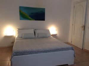 Ένα ή περισσότερα κρεβάτια σε δωμάτιο στο Villa Rosaria
