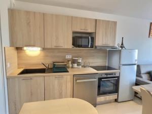 Η κουζίνα ή μικρή κουζίνα στο A 150m de la plage - Coquet appartement pour 4 personnes