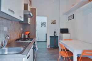 a kitchen with a sink and a counter top at Le Due Baie e le Cinque Terre in Sestri Levante