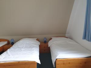 Postel nebo postele na pokoji v ubytování Ferienhaus Anlage Ostland17 Dörpstern Nordseeland17 e