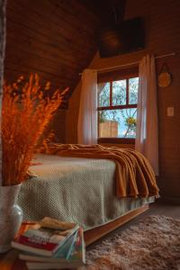 En eller flere senge i et værelse på Chalé Sunset Hills em Campos do Jordão + 17 billeder