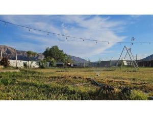a field with a barbed wire in a field at Casa en Zonda in Zonda