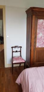 Una cama o camas en una habitación de Vue tour Eiffel