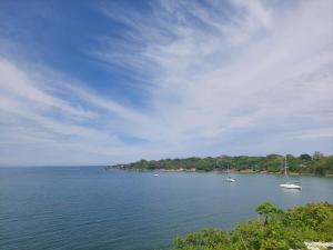 a large body of water with boats in it at Cabaña ecológica frente al mar en isla fuerte in Isla Fuerte