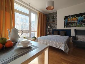 Łóżko lub łóżka w pokoju w obiekcie City Center Studio Apartments
