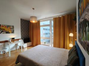 Łóżko lub łóżka w pokoju w obiekcie City Center Studio Apartments