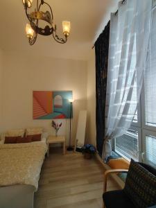 Łóżko lub łóżka w pokoju w obiekcie City Center Studio Apartments
