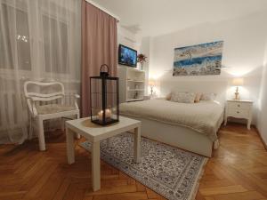 Łóżko lub łóżka w pokoju w obiekcie City Center Studio Apartments