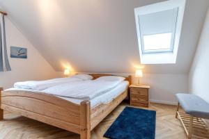 a bedroom with a bed and a window at Haus Eismöwe in Böhl