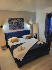 Posteľ alebo postele v izbe v ubytovaní Apartments Mikas