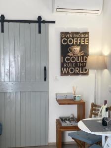 a sliding door in a dining room with a table at Apartman Zeljka in Pula