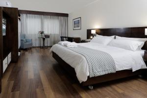 En eller flere senger på et rom på MR Hotel Providencia (ex Hotel Neruda)