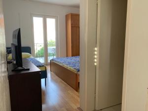 Televízia a/alebo spoločenská miestnosť v ubytovaní Marko Apartment