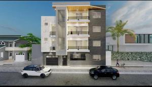 two cars parked in front of a building at Suite royale vue sur mer in Dakar