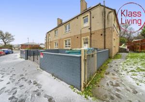 a house with a fence in front of it at Drumpellier Apartment by Klass Living Coatbridge in Coatbridge