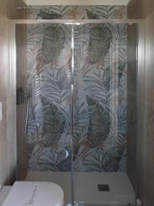 a shower stall with a toilet in a bathroom at Amarena Garden House in Matera +82 photos