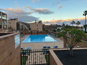 a view of a swimming pool from a balcony at Casa Simar in Playa Jandia
