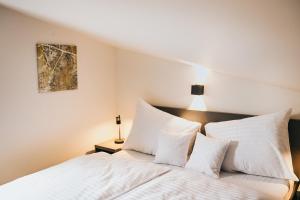 Postel nebo postele na pokoji v ubytování Apartmány DVĚ BOBULE 1 kk