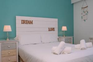 a bedroom with a white bed with white pillows at Piscina y garaje cerca del centro by CABANA Rentals in Vigo +28 photos