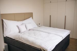 Postel nebo postele na pokoji v ubytování Apartmány DVĚ BOBULE 2KK