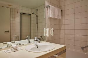 
Ein Badezimmer in der Unterkunft H+ Hotel Leipzig-Halle
