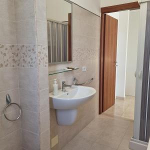 a bathroom with a sink and a mirror at Residence Maresol in Vieste