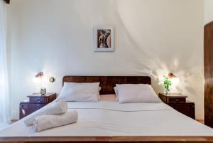 Postel nebo postele na pokoji v ubytování Apartments Bralić