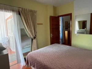 A bed or beds in a room at Casa Mila